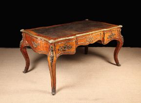 An Imposing Louis XV Style Bureau Plat clad in diagonally grained tulip wood veneers with diamond