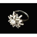 An 18 Carat White Gold Cluster Ring set with baguette cut diamonds around a brilliant cut diamond