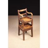 A 19th Century Elm Provincial Child's High Chair.