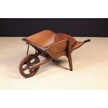 A Late Victorian Painted Pine Library Wheelbarrow for books.