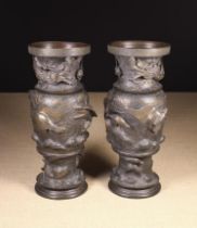 A Pair of Large Dark Brown Patinated Japanese Bronze Baluster Vases cast in three sections,