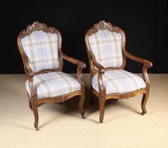 A Pair of Carved Walnut Fautieul Armchairs.