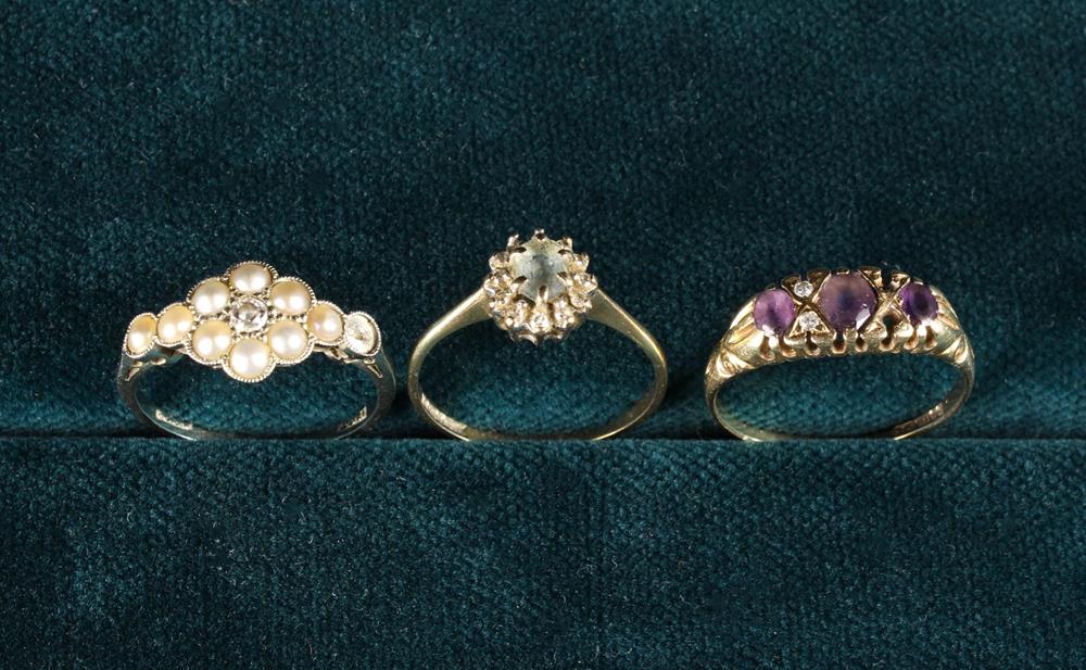 Three Lady's Gold Rings: An 18 Carat White Gold Ring set with seed pearls (one missing) surrounding