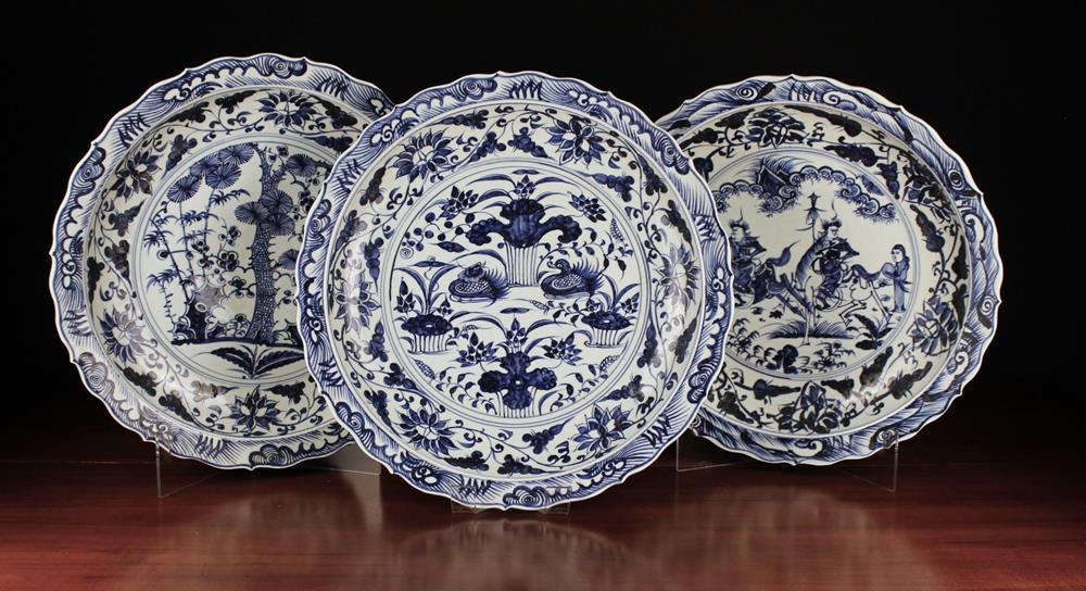 A Set of Three Large Blue & White Chargers with chinoiserie decoration and serpentine borders, - Image 2 of 2