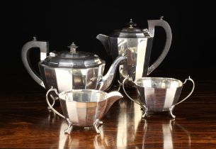 A Four Part Silver Teaset with facetted sides and stylised paw feet by Viner's Ltd (Emile Viner)