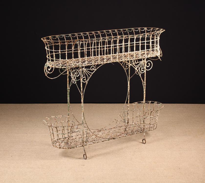 A Victorian Painted Wire Two Tier Plant Stand, 37" (94 cm) high, 41½" (106 cm) wide,