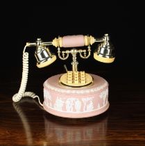 A Vintage Astral Pink Wedgwood Jasperware Telphone with press button dial.