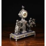 An Ornate 19th Century Silver Figural Clock with intricately engraved decoration enriched with