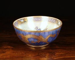 A Wedgwood Lustre Bowl decorated in fine line gilding with chinoiserie dragons to the turquoise