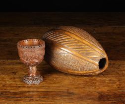 A Late 18th/Early 19th Century Coquilla Nut Egg Cup intricately carved with overlapped flower heads
