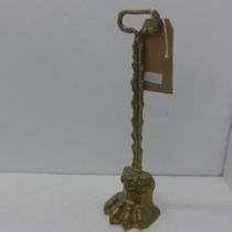A brass claw door stop - Height 39cm