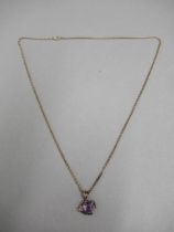 A 9ct rose gold (hallmarked & tested) pendant and chain with amethyst - pendant 2cm with ring -