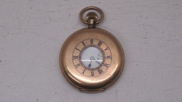An Elgin gold plated half hunter pocket watch - approx 5cm diameter - working in the saleroom but