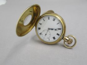 A yellow gold plated half hunter pocket watch - 5cm - good overall condition, working in the