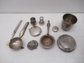 Assorted silver items - two powder compact, pepper shakers, cup, tea strainers, fruit knife,