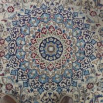 A hand woven Nain Persian rug - 300cm x 196cm