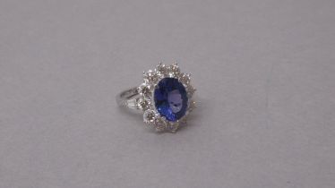 A certificated large 18ct white gold AAA tanzanite and diamond cluster ring - Oval cut tanzanite 4.