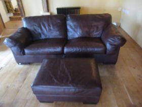 A John Lewis leather sofa and foot stool