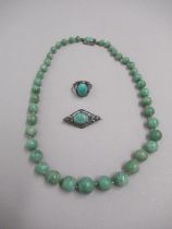 An early 20th century string of 41 graduated Jade beads - largest central bead approx 12mm -