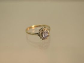 A 9ct hallmarked yellow gold sapphire and diamond cluster ring size J - weight approx 1.4 grams