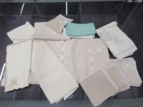 A quantity of embroidered linen table cloths etc