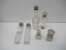 Six silver topped cut glass bottles