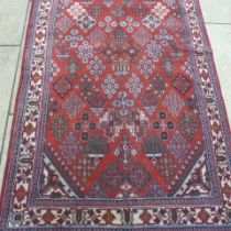 A Meimeh hand knotted woollen rug - 3.98m x 1.85m