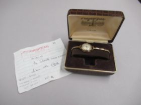 A ladies 9ct yellow gold hallmarked cased Smiths Astral wristwatch, 23mm round case, with gold