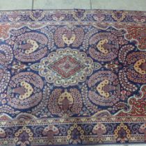 A Kashan hand knotted woollen rug - 2.18m x 1.30m