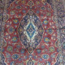 A Kashan hand knotted woollen rug - 2.15m x 1.05m