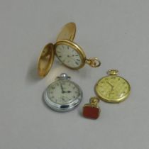 Two gold plated pocket watches, neither currently working together with a gold plated fob seal and a