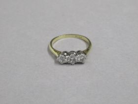 An 18ct yellow gold and diamond three stone ring - total diamond weight approx 0.64ct - assessed