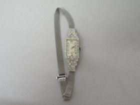 An Art Deco platinum cased (hallmarked) and diamond set cocktail watch - not currently working -