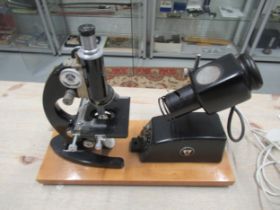 A C.Baker microscope with electric lamp