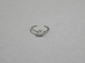 A diamond solitaire ring set in platinum - the single round brilliant cut diamond approx 0.8ct - the