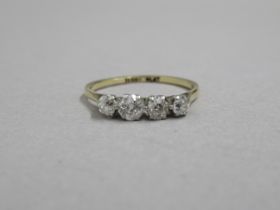 An 18ct yellow gold (hallmarked) four stone diamond ring size M/N - approx weight 1.7 grams