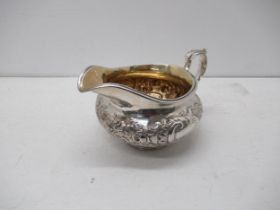 A Victorian cast silver cream/milk jug - William Wrangham Williams, London 1866 - 16cm x 9cm -