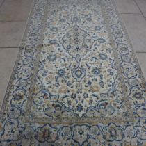 A Kashan hand knotted woollen rug - 2.70m x 1.52m