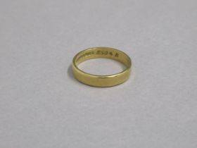 A 22ct yellow gold hallmarked band ring, size Q, approx 4.7 grams