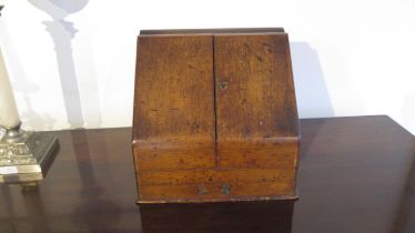 An oak writing box with internal calendar etc - approx 30cm x 29cm x 22cm