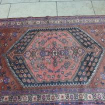 A Hamadan hand knotted woollen rug - 2.26m x 1.30m