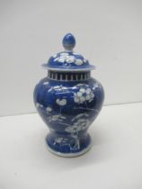 A Chinese blue and white prunus temple jar and cover, 4 character mark to base, approx 22cm, good