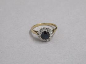 An 18ct yellow gold sapphire and diamond cluster ring, hallmarked, size Q, approx 4grams