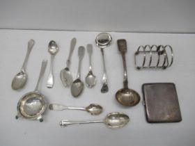 Assorted silver items, two silver ladles, tea strainer, cigarette and spoons, toast rack, approx