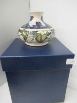 A Moorcroft June Berry squat vase, boxed, in very good condition