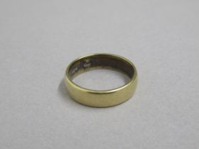 An 18ct yellow gold hallmarked band ring, size L/M, approx 4.9 grams