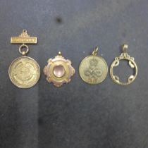 Four 9ct (hallmarked) medals/pendants - approx weight 23 grams