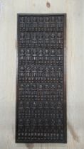 A Mali Dogon carved wood panel - 71cm x 27cm