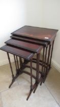 A mahogany nest of four tables