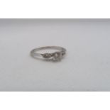 A 14ct white gold diamond ring with diamond shoulders - centre diamond approx 0.5ct - diamonds are